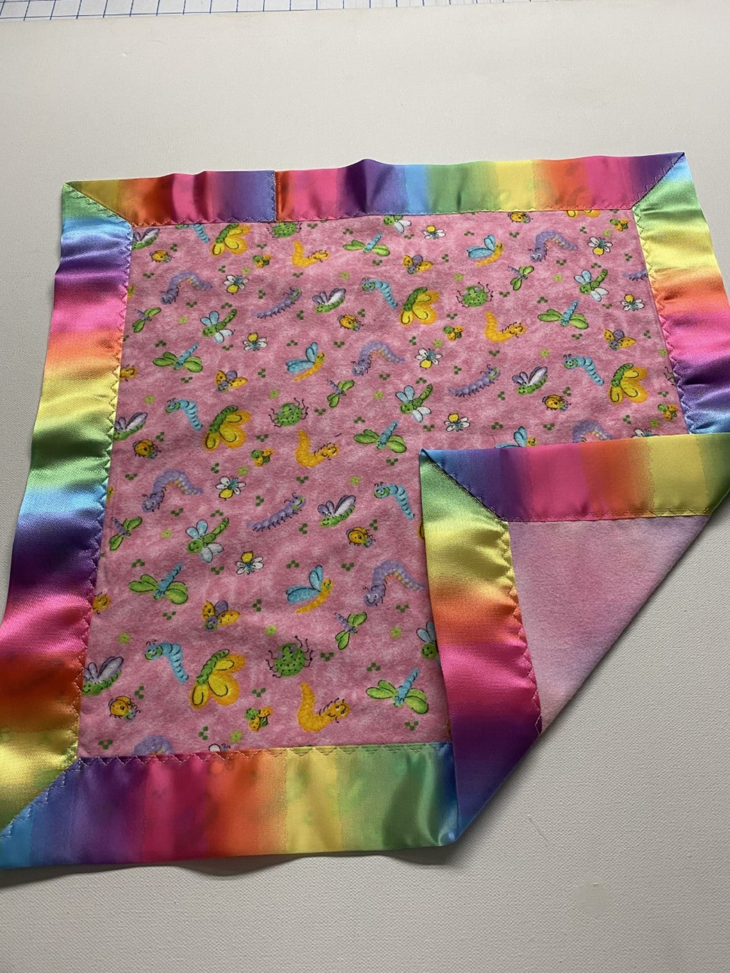 Happy Bugs Pink Flannel Lovey w/Rainbow Satin Binding